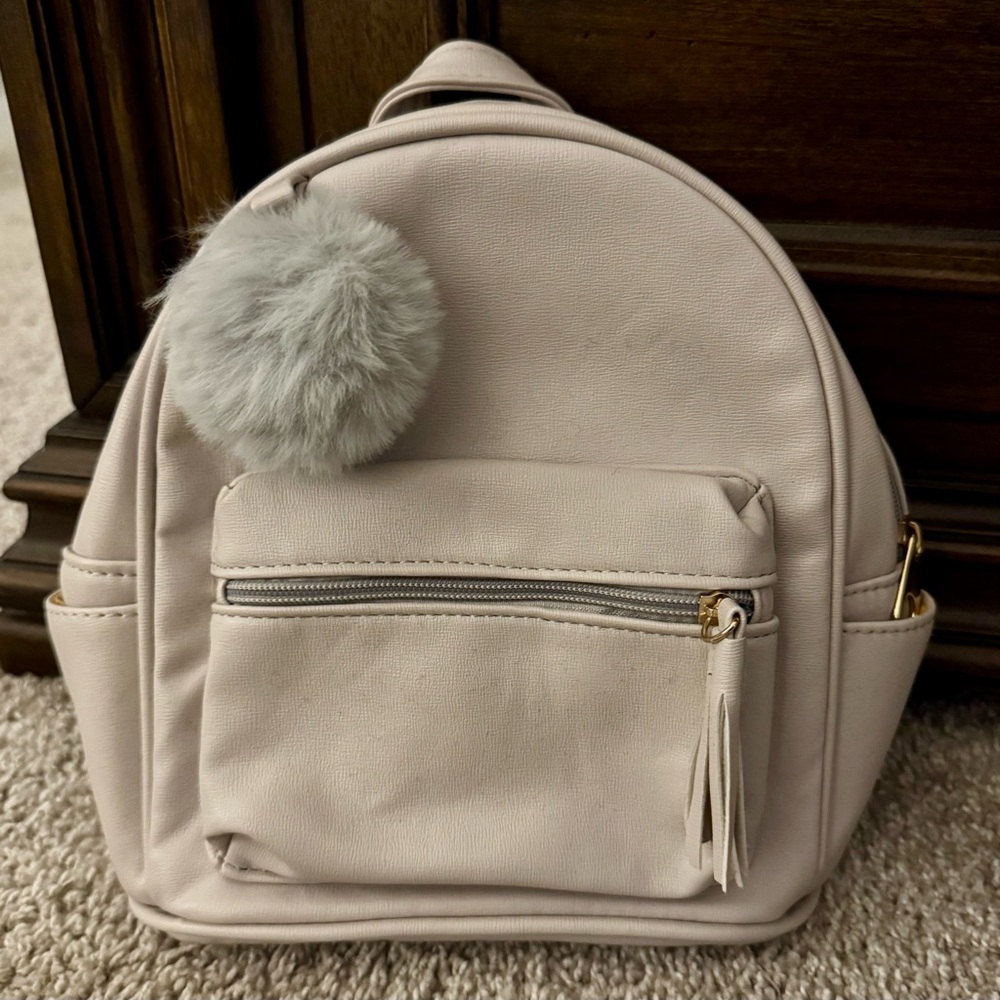NWOT Stylish Cream Mini Backpack with Pom Pom